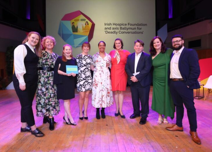 A photo of representatives from Irish Hospice Foundation on stage accepting a Business to Arts Awards for "Best Creativity in the Community".